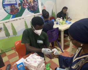 Lab Personnel taking a beneficiaries Sample at Mrs Opeyemi's Birthday held on the 18th of January 2025