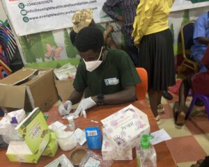 Lab Personnel taking a beneficiaries Sample at Mrs Opeyemi's Birthday held on the 18th of January 2025