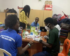 Lab Personnel taking a beneficiaries Sample at Mrs Opeyemi's Birthday held on the 18th of January 2025